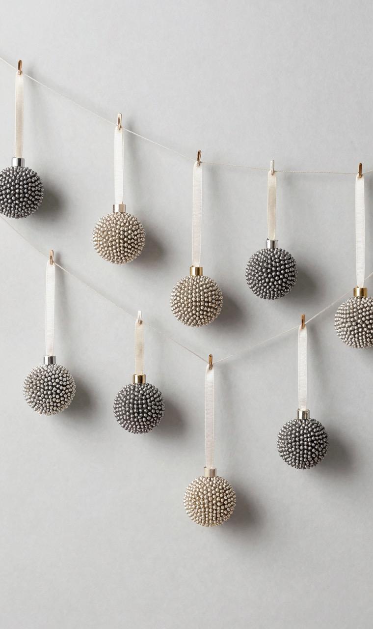 Ornaments strung as a garland on a tree